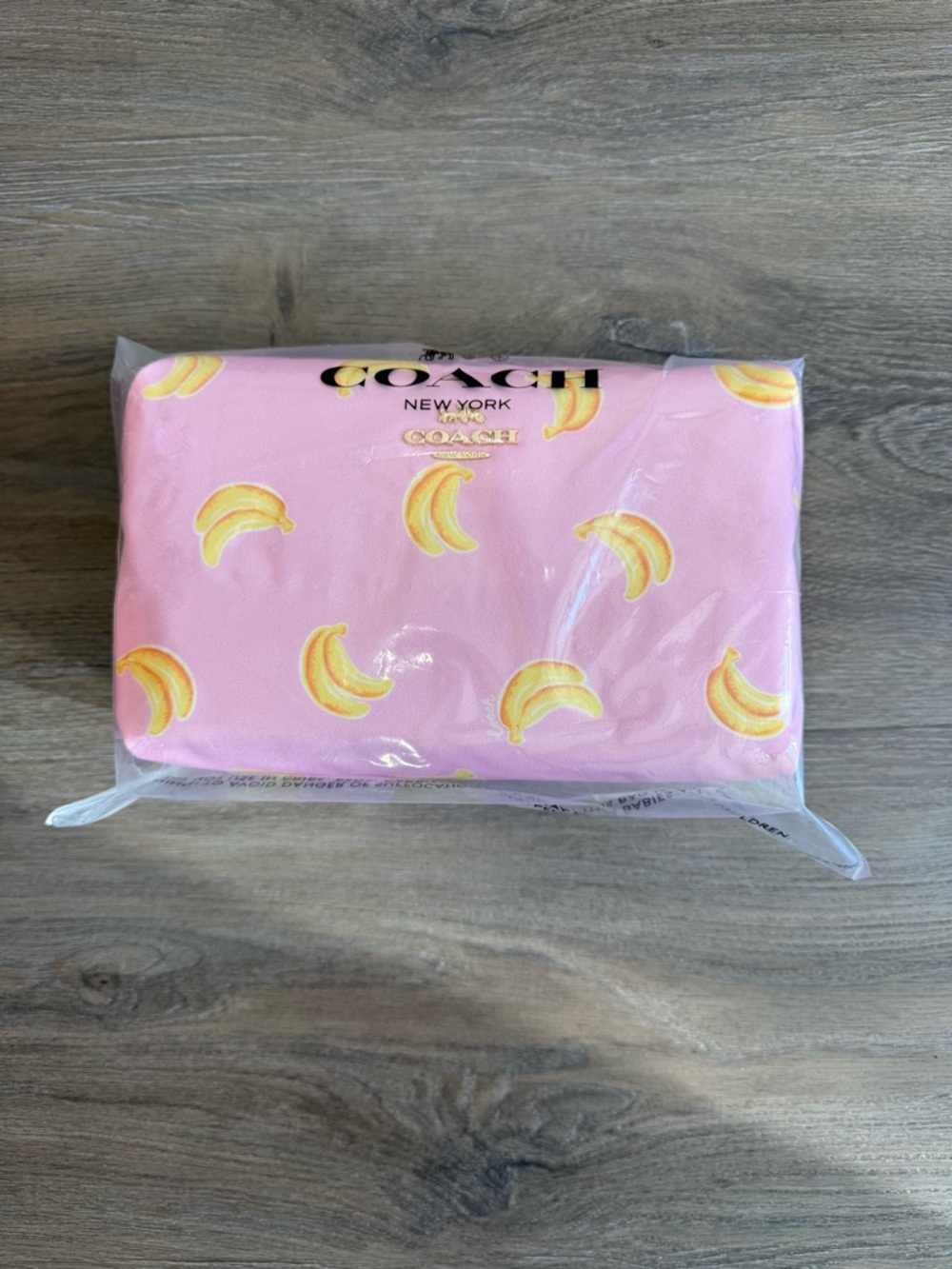 COACH Pink Banana Print Pouch with Gold Logo